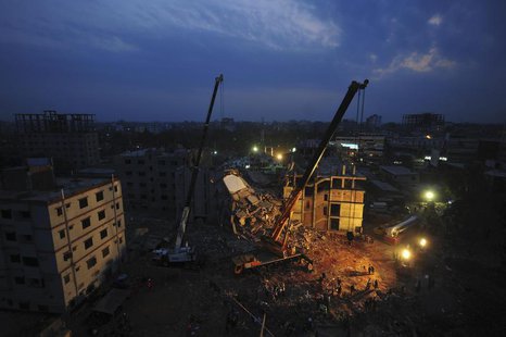Rescue workers attempt to rescue garment workers from the rubble of the collapsed Rana Plaza building, in Savar, 30 km (19 miles) outside Dh Rescue workers attempt to rescue garment workers from the rubble of the collapsed Rana Plaza building, in Savar, 30 km (19 miles) outside Dh