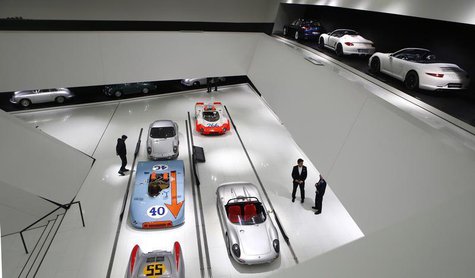 Visitors stroll through the museum of German sports car manufacturer Porsche in Stuttgart, January 9, 2013. REUTERS/Kai Pfaffenbach Visitors stroll through the museum of German sports car manufacturer Porsche in Stuttgart, January 9, 2013. REUTERS/Kai Pfaffenbach