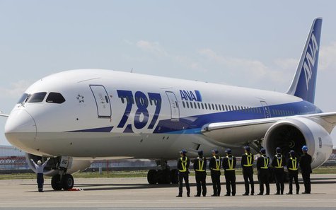 Employees of All Nippon Airways (ANA) queue in front of the company's Boeing 787 Dreamliner plane after its test flight at Haneda airport in Employees of All Nippon Airways (ANA) queue in front of the company's Boeing 787 Dreamliner plane after its test flight at Haneda airport in