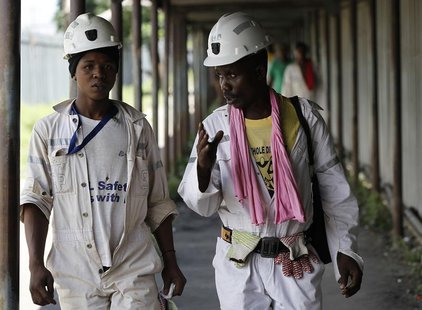 Miners walk at the end of their shift at the Anglo Platinum's Khuseleka shaft 1 mine in Rustenburg, northwest of Johannesburg, January 15, 2 Miners walk at the end of their shift at the Anglo Platinum's Khuseleka shaft 1 mine in Rustenburg, northwest of Johannesburg, January 15, 2