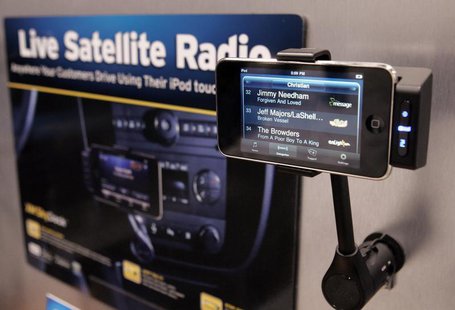 An Apple iPhone is shown in a XM Skydock at the Sirius Satellite Radio booth during the 2010 International Consumer Electronics Show (CES) i An Apple iPhone is shown in a XM Skydock at the Sirius Satellite Radio booth during the 2010 International Consumer Electronics Show (CES) i