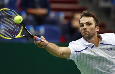 Croatia's Ivo Karlovic hits a return against Brazil's Thomaz Bellucci during their Kremlin Cup semifinal tennis match in Moscow October 20, Croatia's Ivo Karlovic hits a return against Brazil's Thomaz Bellucci during their Kremlin Cup semifinal tennis match in Moscow October 20,