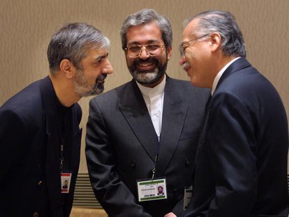 Chairman of the Group of 77, Ambassador Bagher Asadi, (L) and Mohsen Nourbakhsh, Governor of the IMF for Iran (C), talk with outgoing Chairm Chairman of the Group of 77, Ambassador Bagher Asadi, (L) and Mohsen Nourbakhsh, Governor of the IMF for Iran (C), talk with outgoing Chairm