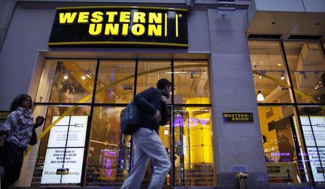 People walk past a Western Union branch at Times Square in New York November 30, 2011. REUTERS/Eduardo Munoz People walk past a Western Union branch at Times Square in New York November 30, 2011. REUTERS/Eduardo Munoz