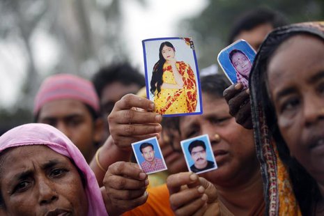 Relative show pictures of garment workers who are missing, during a protest to demand capital punishment for those responsible for the colla Relative show pictures of garment workers who are missing, during a protest to demand capital punishment for those responsible for the colla