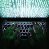 A man types on a computer keyboard in Warsaw in this February 28, 2013 illustration file picture. REUTERS/Kacper Pempel/Files