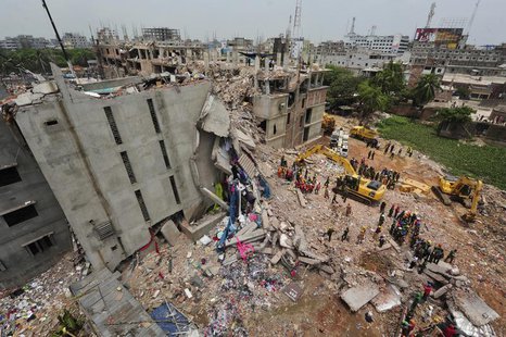 A view of rescue workers attempting to find survivors from the rubble of the collapsed Rana Plaza building in Savar, around 30 km (19 miles) A view of rescue workers attempting to find survivors from the rubble of the collapsed Rana Plaza building in Savar, around 30 km (19 miles)