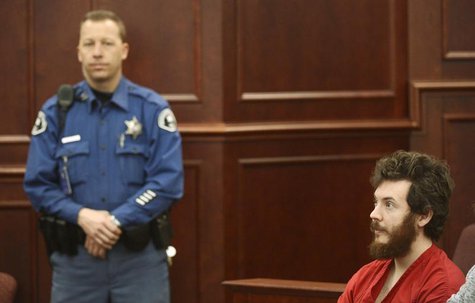Accused Aurora theater shooting suspect James Holmes listens at his arraignment in Centennial, Colorado March 12, 2013. REUTERS/R.J. Sangost Accused Aurora theater shooting suspect James Holmes listens at his arraignment in Centennial, Colorado March 12, 2013. REUTERS/R.J. Sangost