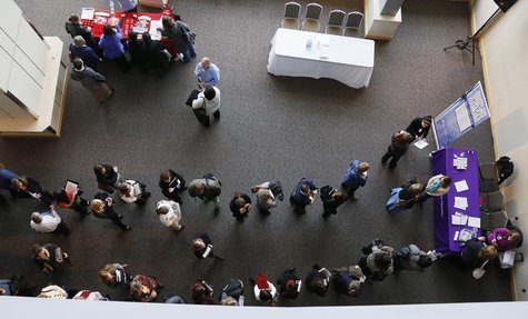 Hundreds of job seekers wait in line with their resumes to talk to recruiters (right) at the Colorado Hospital Association health care caree Hundreds of job seekers wait in line with their resumes to talk to recruiters (right) at the Colorado Hospital Association health care caree