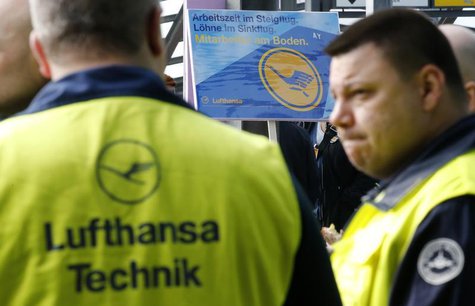 Union members attend a rally as they take part in a warning strike of German air carrier Lufthansa's ground personnel at Tegel airport in Be Union members attend a rally as they take part in a warning strike of German air carrier Lufthansa's ground personnel at Tegel airport in Be