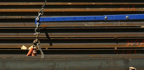 A worker guides a steel beam into place at a construction site in San Francisco, California September 1, 2011. REUTERS/Robert Galbraith A worker guides a steel beam into place at a construction site in San Francisco, California September 1, 2011. REUTERS/Robert Galbraith