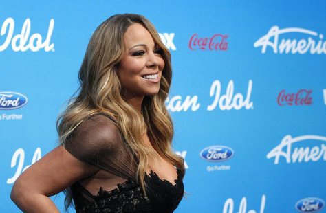 Judge Mariah Carey poses at the party for the finalists of the television show "American Idol" in Los Angeles, California March 7, 2013. REU Judge Mariah Carey poses at the party for the finalists of the television show "American Idol" in Los Angeles, California March 7, 2013. REU