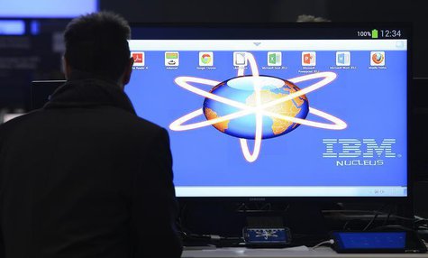 An employee installs a computer at the booth of IBM during preparations at the CeBit computer fair in Hanover, March, 4, 2013. REUTERS/Fabia An employee installs a computer at the booth of IBM during preparations at the CeBit computer fair in Hanover, March, 4, 2013. REUTERS/Fabia