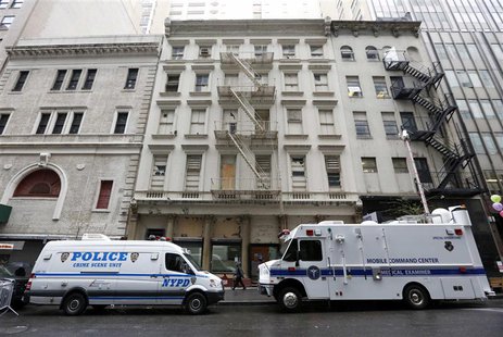 A New York Police Department truck and a City of New York Medical Examiner mobile lab park in front of 51 Park Place in New York, April 29, A New York Police Department truck and a City of New York Medical Examiner mobile lab park in front of 51 Park Place in New York, April 29,
