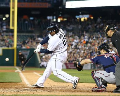 HE DID IT AGAIN: Detroit Tigers 1B Prince Fielder connects on a Vance Worley pitch in the fifth inning for a two-run homer as catcher Joe Mauer and home plate Chad Fairchild (L) to cap Detroit's 6-1 victory over the Twins on Apr. 30, 2013. (photo courtesy Detroit Tigers) HE DID IT AGAIN: Detroit Tigers 1B Prince Fielder connects on a Vance Worley pitch in the fifth inning for a two-run homer as catcher Joe Mauer and home plate Chad Fairchild (L) to cap Detroit's 6-1 victory over the Twins on Apr. 30, 2013. (photo courtesy Detroit Tigers)