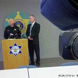 Winnebago Co. Sheriff John Matz, left, and District Attorney Christian Gossett hold a news conference May 1, 2013, to discuss the April 19 fatal shooting of a man by a town of Menasha police officer. (courtesy of FOX 11).