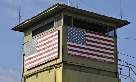 A U.S. Marine guard tower overlooks the Northeast gate leading into Cuba territory at Guantanamo Bay U.S. Naval Base, March 8, 2013. Picture A U.S. Marine guard tower overlooks the Northeast gate leading into Cuba territory at Guantanamo Bay U.S. Naval Base, March 8, 2013. Picture