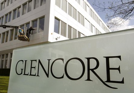 A worker uses a mobile lift to clean the windows of the headquarters of Swiss commodities trader Glencore in Baar near Zurich April 13, 2011 A worker uses a mobile lift to clean the windows of the headquarters of Swiss commodities trader Glencore in Baar near Zurich April 13, 2011