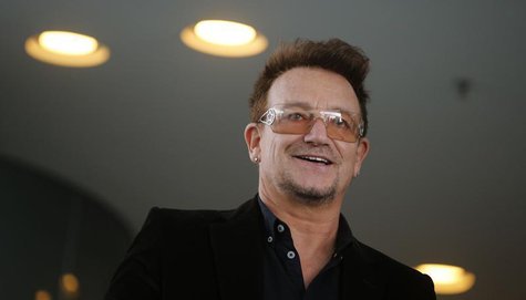 Bono, lead singer of the band U2 and ONE organisation co-founder arrives for a reception with German Chancellor Angela Merkel and with youth Bono, lead singer of the band U2 and ONE organisation co-founder arrives for a reception with German Chancellor Angela Merkel and with youth
