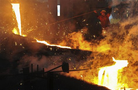 An employee works at a steel factory in Dalian, Liaoning province, May 1, 2013. REUTERS/China Daily An employee works at a steel factory in Dalian, Liaoning province, May 1, 2013. REUTERS/China Daily