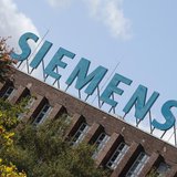 The logo of Siemens AG company is pictured atop a factory in Berlin October 9, 2012. REUTERS/Fabrizio Bensch
