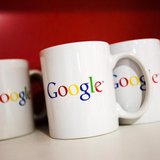 Coffee cups with Google logos are seen at the new Google office in Toronto, November 13, 2012. REUTERS/Mark Blinch