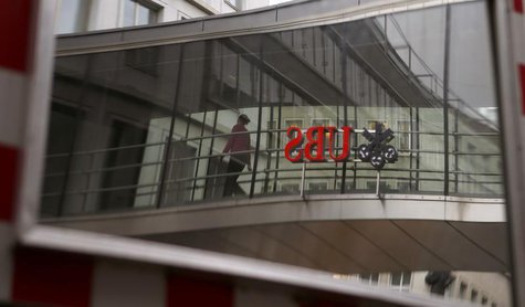 The logo of Swiss bank UBS is reflected in a traffic mirror in Zurich April 30, 2013. REUTERS/Arnd Wiegmann The logo of Swiss bank UBS is reflected in a traffic mirror in Zurich April 30, 2013. REUTERS/Arnd Wiegmann