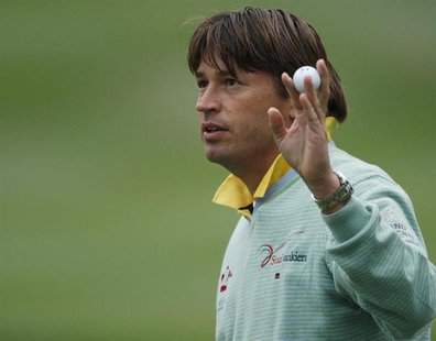 Robert-Jan Derksen of the Netherlands acknowledges spectators after putting on the 18th green during the third round of the Hong Kong Open g Robert-Jan Derksen of the Netherlands acknowledges spectators after putting on the 18th green during the third round of the Hong Kong Open g
