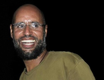 Saif al-Islam, the son of Libyan leader Muammar Gaddafi, smiles as he greets supporters in Tripoli in this August 23, 2011 file photo. REUTE Saif al-Islam, the son of Libyan leader Muammar Gaddafi, smiles as he greets supporters in Tripoli in this August 23, 2011 file photo. REUTE