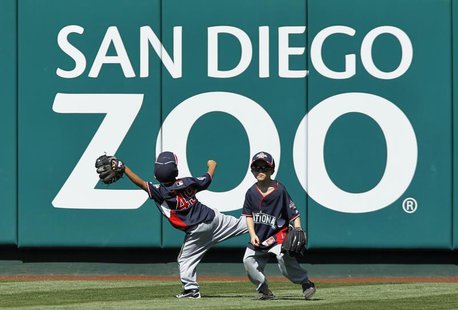 Unidentified children of National League All-Stars play in the outfield during practice for Major League Baseball's All-Star Game in Anaheim Unidentified children of National League All-Stars play in the outfield during practice for Major League Baseball's All-Star Game in Anaheim