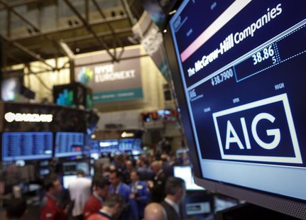 The American International Group, Inc. (AIG) stock ticker is seen on a monitor as traders work on the floor of the New York Stock Exchange a The American International Group, Inc. (AIG) stock ticker is seen on a monitor as traders work on the floor of the New York Stock Exchange a