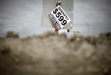 A sign advertising bankruptcy filing is seen hanging off a road sign in San Bernardino, California September 11, 2012. REUTERS/Lucy Nicholso A sign advertising bankruptcy filing is seen hanging off a road sign in San Bernardino, California September 11, 2012. REUTERS/Lucy Nicholso