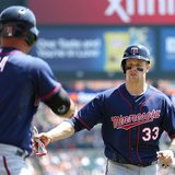 Minnesota 1B Justin Morneau (R) is congratulated by LF Oswaldo Arcia (L) after scoring in the first inning of the Twins' 6-2 win over the Detroit Tigers at Comerica Park in Detroit on May 1, 2013. (photo courtesy Minnesota Twins)