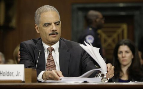 U.S. Attorney General Eric Holder refers to his notes during testimony before the Senate Judiciary Committee on Capitol Hill in Washington, U.S. Attorney General Eric Holder refers to his notes during testimony before the Senate Judiciary Committee on Capitol Hill in Washington,
