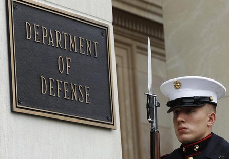A U.S. Marine, who is part of a military honor guard, takes his position before a welcoming ceremony for German Defense Minister Thomas de M A U.S. Marine, who is part of a military honor guard, takes his position before a welcoming ceremony for German Defense Minister Thomas de M