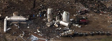An aerial view shows investigators walking through the aftermath of a massive explosion at a fertilizer plant in the town of West, near Waco An aerial view shows investigators walking through the aftermath of a massive explosion at a fertilizer plant in the town of West, near Waco