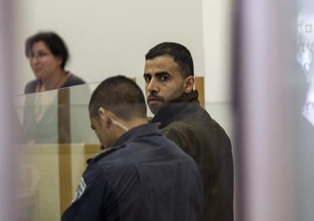 Hikmat Massarwa (R), a member of Israel's Arab minority, attends a remand hearing at the Central District Court in Lod, near Tel Aviv April Hikmat Massarwa (R), a member of Israel's Arab minority, attends a remand hearing at the Central District Court in Lod, near Tel Aviv April