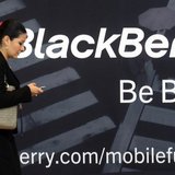 A woman uses her mobile phone at the Blackberry World Event in Orlando May 1, 2012. REUTERS/David Manning