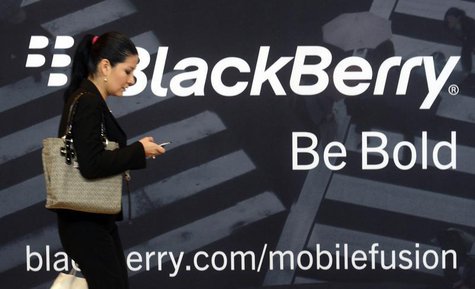A woman uses her mobile phone at the Blackberry World Event in Orlando May 1, 2012. REUTERS/David Manning A woman uses her mobile phone at the Blackberry World Event in Orlando May 1, 2012. REUTERS/David Manning