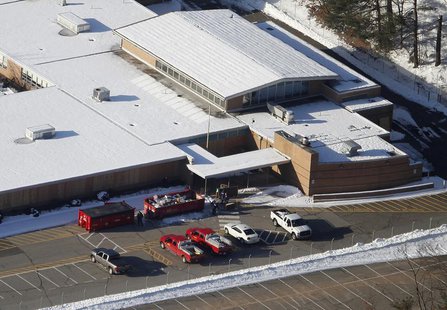 People put items from the old Sandy Hook School into garbage containers as they clean up the school in Sandy Hook, Connecticut January 3, 20 People put items from the old Sandy Hook School into garbage containers as they clean up the school in Sandy Hook, Connecticut January 3, 20