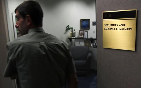 A man walks past a doorway at the Fort Worth Regional Office of the Securities and Exchange Commission (SEC) in Fort Worth, Texas June 28, 2 A man walks past a doorway at the Fort Worth Regional Office of the Securities and Exchange Commission (SEC) in Fort Worth, Texas June 28, 2