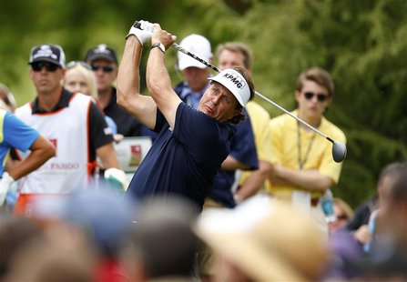 Phil Mickelson of the U.S. watches his tee shot on the eighth hole during the second round of the Wells Fargo Championship PGA golf tourname Phil Mickelson of the U.S. watches his tee shot on the eighth hole during the second round of the Wells Fargo Championship PGA golf tourname