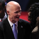 Florida Governor Rick Scott greets an attendee in the audience before the start of the final U.S. presidential debate between Republican pre Florida Governor Rick Scott greets an attendee in the audience before the start of the final U.S. presidential debate between Republican pre
