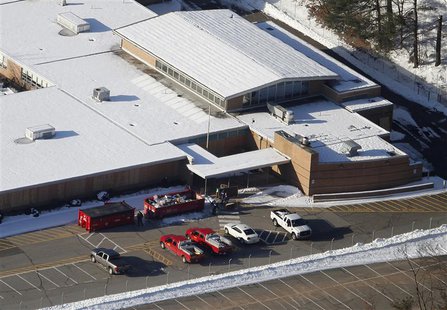 People put items from the old Sandy Hook School into garbage containers as they clean up the school in Sandy Hook, Connecticut January 3, 20 People put items from the old Sandy Hook School into garbage containers as they clean up the school in Sandy Hook, Connecticut January 3, 20