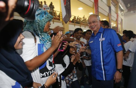Malaysia's Prime Minister Najib Razak (R) is greeted by youngsters after launching the "Voices of My Generation" youth programme in Kuala Lu Malaysia's Prime Minister Najib Razak (R) is greeted by youngsters after launching the "Voices of My Generation" youth programme in Kuala Lu