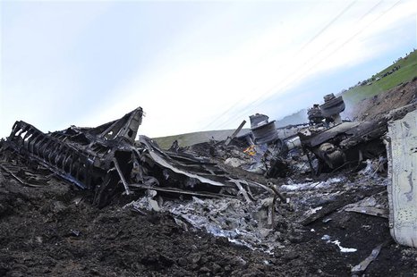 The wreckage of the Boeing KC-135 Stratotanker plane is seen at the site of its crash near the Kyrgyz village of Chaldovar, May 3, 2013. REU The wreckage of the Boeing KC-135 Stratotanker plane is seen at the site of its crash near the Kyrgyz village of Chaldovar, May 3, 2013. REU