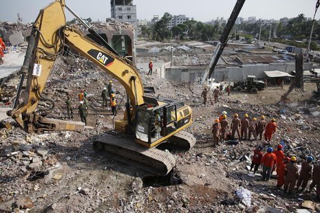 Rescue workers attempt to find survivors from the rubble of the collapsed Rana Plaza building in Savar, around 30 km (19 miles) outside Dhak Rescue workers attempt to find survivors from the rubble of the collapsed Rana Plaza building in Savar, around 30 km (19 miles) outside Dhak