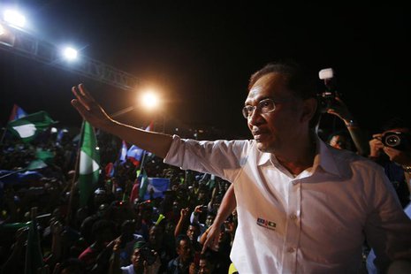 Malaysia's opposition leader Anwar Ibrahim waves to his supporters during an election campaign in Seberang Jaya May 4, 2013. Support for Mal Malaysia's opposition leader Anwar Ibrahim waves to his supporters during an election campaign in Seberang Jaya May 4, 2013. Support for Mal