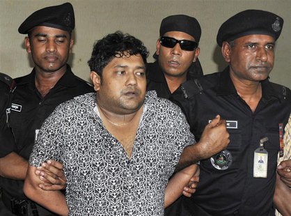 Members of the Rapid Action Battalion (RAB) present Mohammed Sohel Rana to the media after his arrest in Jessore, in Dhaka, in this file pic Members of the Rapid Action Battalion (RAB) present Mohammed Sohel Rana to the media after his arrest in Jessore, in Dhaka, in this file pic