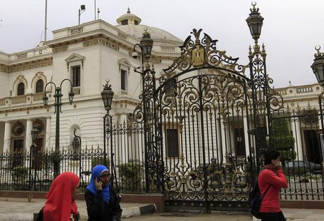 People walk in front of parliament in Cairo March 7, 2013. REUTERS/Mohamed Abd El Ghany People walk in front of parliament in Cairo March 7, 2013. REUTERS/Mohamed Abd El Ghany